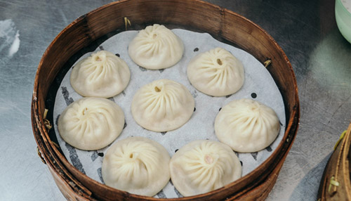Freshly steamed xiaolongbao, that translated as the “little caged bun